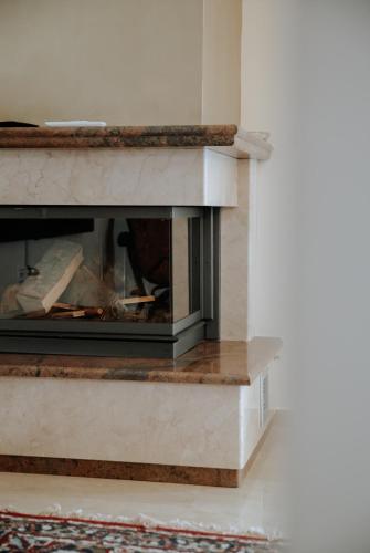 a fireplace in a living room with a fire place at Friendly Flat 5 in Edessa