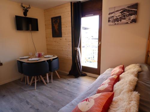 Appartement cosy dans le centre du village, proche pistes et ESF, avec balcon et équipements complets
