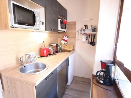 Appartement cosy dans le centre du village, proche pistes et ESF, avec balcon et équipements complets