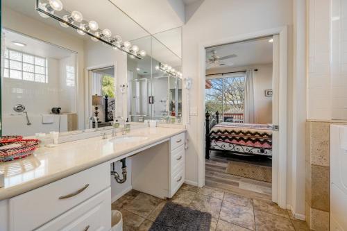 a bathroom with two sinks and a large mirror at Sedona Sunbeam in Sedona