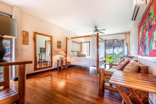 a living room with a couch and a table at Villa Marbella in Islita
