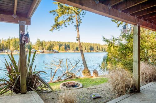 a view of a lake from the porch of a house at Treasure Island Escape in Allyn