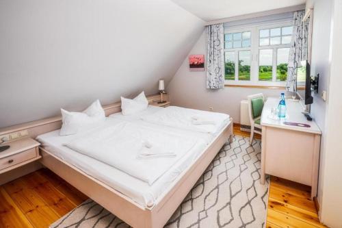 Una cama o camas en una habitación de Elbterrasse Wörlitz