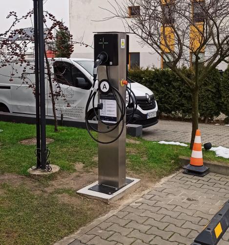 a pay phone sitting on the side of a street at Hotel Splendor in Babice Nowe
