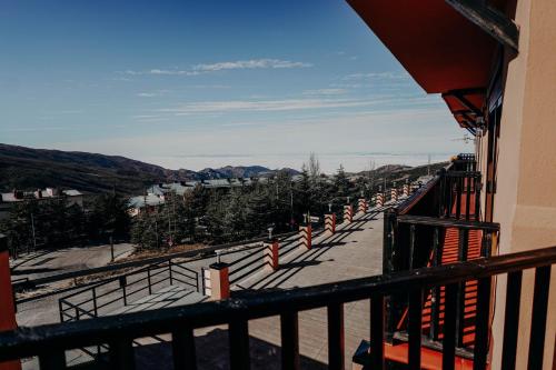 a balcony of a building with a view of a valley at Apartamentos Boabdil in Sierra Nevada