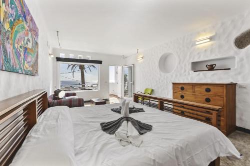 a bedroom with a bed with a towel on it at Villa Atlantico - Villasexperience in Arrecife