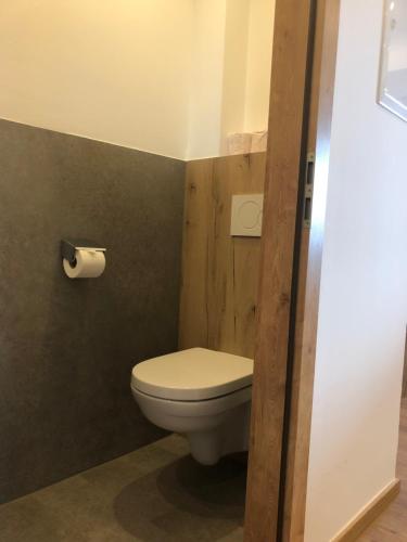 a bathroom with a toilet and a roll of toilet paper at Gästehaus Wieshof in Vent