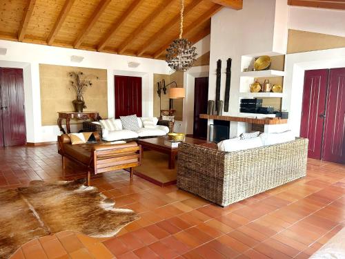 a living room with two couches and a table at Naturarte Campo - Duna Parque Group in São Luis