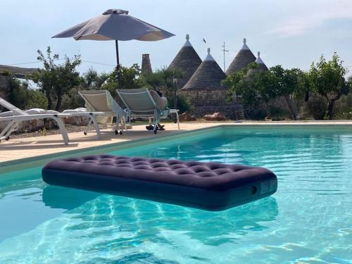 Photo de la galerie de l'établissement Trullo Antico con piscina indipendente - Trulli Finisterrae, à Ceglie Messapica