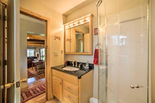 a bathroom with a sink and a shower at Idyllic Dolores Cabin with Fire Pit and Lake Views! in Dolores