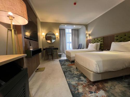 Postel nebo postele na pokoji v ubytování President Hotel