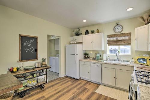 a kitchen with white cabinets and a white refrigerator at Centrally Located House in Chico with Gas Grill in Chico