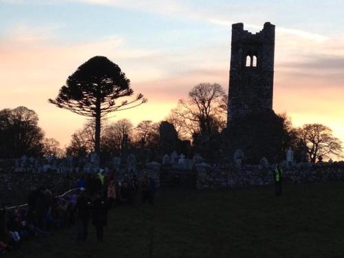 a group of people standing in front of a tower at Forest Hills Lodge in Slane