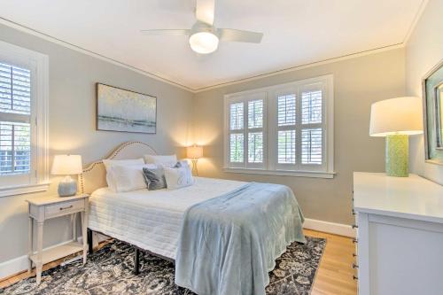 a bedroom with a bed and two windows at Columbia Vacation Rental Less Than 2 Mi to University in Columbia