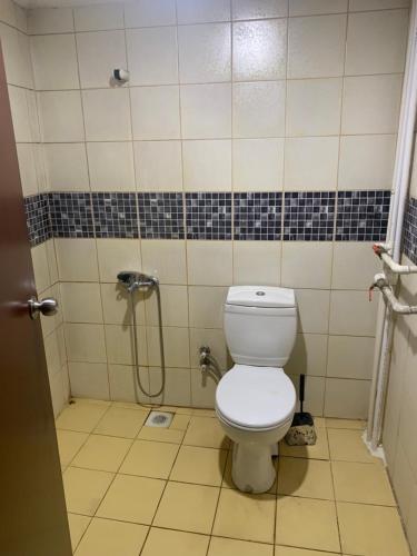 a bathroom with a toilet and a shower at Amkara apart hostel 5 in Altındağ