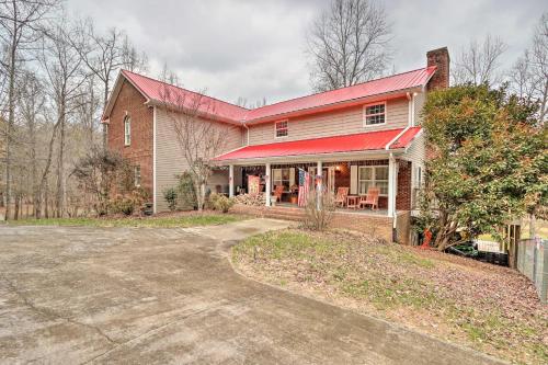 a large house with a red roof and a driveway at Mountain-View Ocoee Escape Near Lake Ocoee! in Ocoee