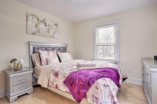 a bedroom with a large bed and a window at Charming Mamaroneck Home about 22 Mi to Manhattan 