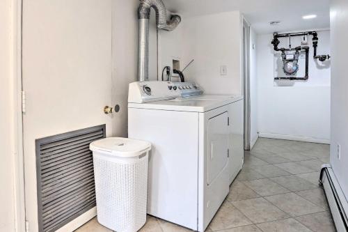 a white laundry room with a washer and dryer at Charming Mamaroneck Home about 22 Mi to Manhattan 