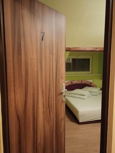 a open door to a bedroom with a bunk bed at Penzion U bílého jaka in Vilémov