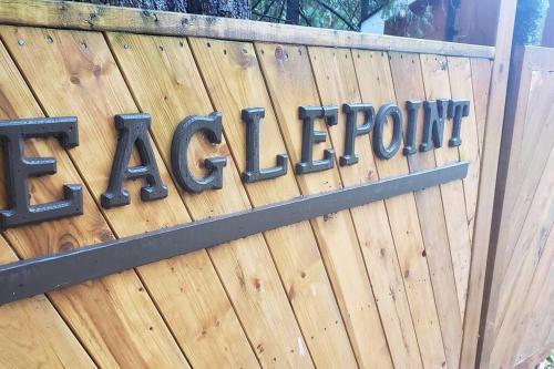 a sign on a wooden fence with the word inventory at Modern Chic Cottage - Hot Tub, Sauna, Tay Trail in Waubaushene