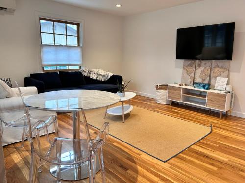 a living room with a couch and a table at North End Bungalow in Boise