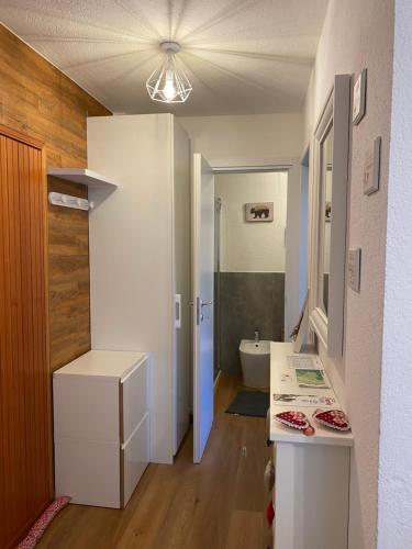 a bathroom with a sink and a toilet in a room at Appartamento Antey Saint André posizione centrale in Antey-Saint-André