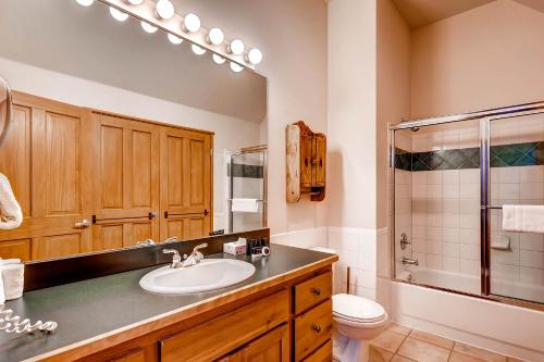 a bathroom with a sink and a shower and a toilet at Jackpine & Black Bear Condominiums by Keystone Resort in Keystone