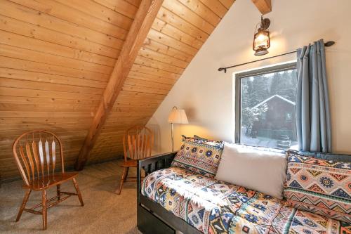 a living room with a couch and a window at The Fishermans Place Peaceful with Mountain Views in Breckenridge
