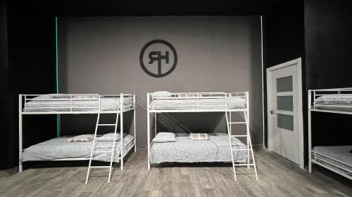 a room with three bunk beds in it at Rio Hostel in Madrid