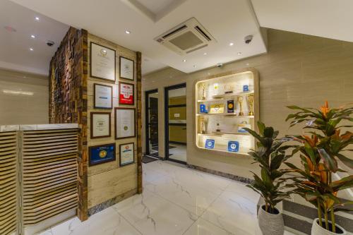 a room with an open refrigerator and a plant at Hotel Ocean Grand at Hulhumale in Hulhumale