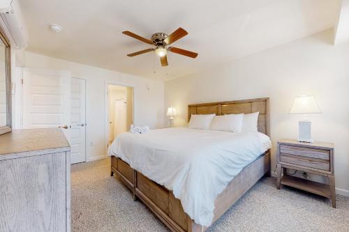 a bedroom with a bed and a ceiling fan at Rehoboth Beach House --- 20494 Coastal Highway Unit #9 in Rehoboth Beach