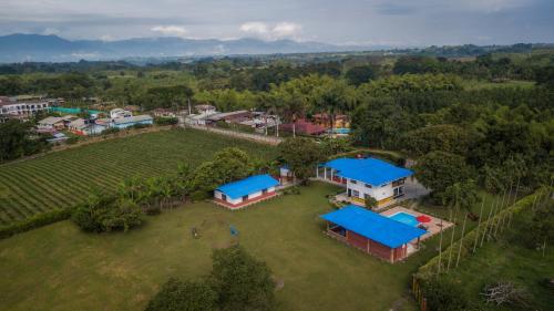 an aerial view of a house with blue roofs at Finca el Bosque in Montenegro