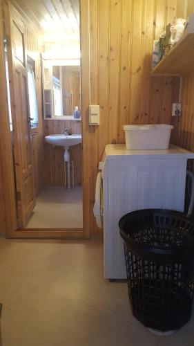 a bathroom with a sink and a mirror at Kjørsvik Øvre in Tornes