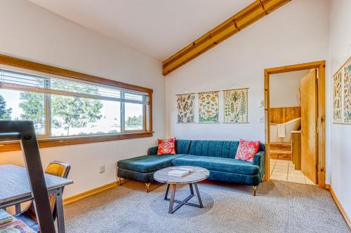 a living room with a couch and a table at Six Mountain View in Sisters