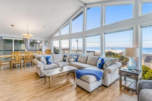 a living room with a couch and a table at The Boat House Retreat in Lincoln City