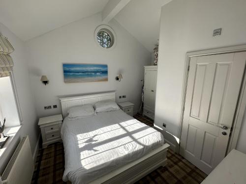 Katil atau katil-katil dalam bilik di Sandy Bay Hideaway