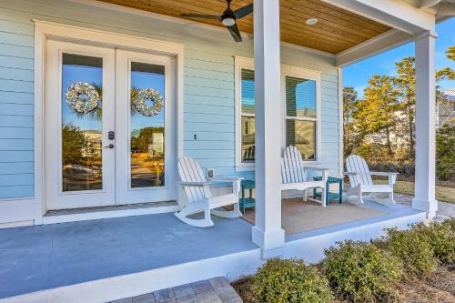 a porch with a table and chairs on it at Come Sail Away in Inlet Beach