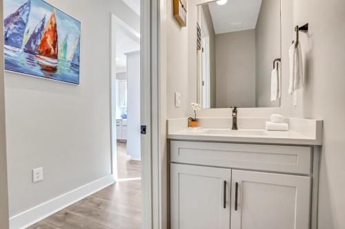 a bathroom with a white sink and a mirror at Come Sail Away in Inlet Beach