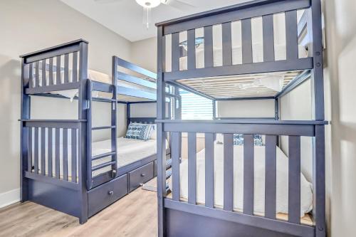 a couple of bunk beds in a room with a bed at Come Sail Away in Inlet Beach