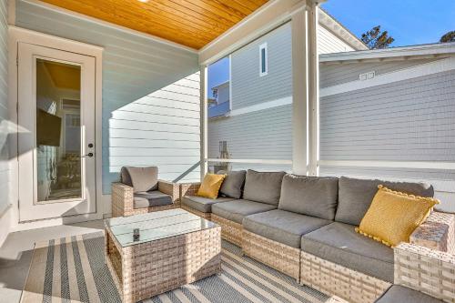 a patio with a couch and a table on a house at Come Sail Away in Inlet Beach