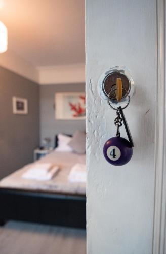 a door with a key in a room with a bed at Laburnum Guest House at Bistro En Glaze in Wylam