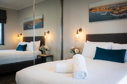 Postel nebo postele na pokoji v ubytování Merewether Motel