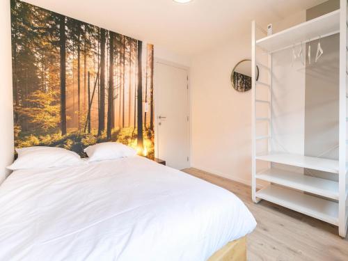 Cama o camas de una habitación en Maasmechelen Duplex Retreat