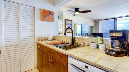 a kitchen with a sink and a counter top at Maui Westside Presents: Mahana 1003 in Lahaina
