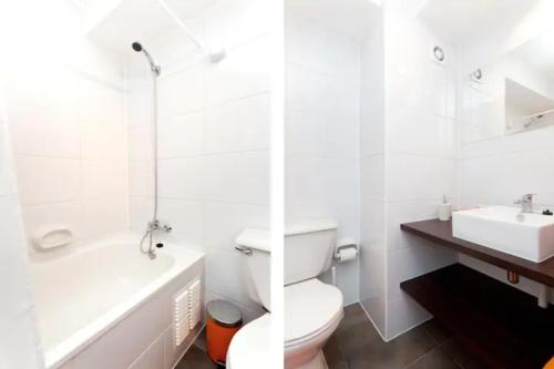a white bathroom with a toilet and a sink at Apartment located in midtown in Santiago