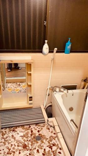 a bathroom with a shower and a tub and a sink at 江ノ島に近い富士山も眺める湘南の丘のヴィラーーー日本スタイルを体験できるTatami Room in Fujisawa