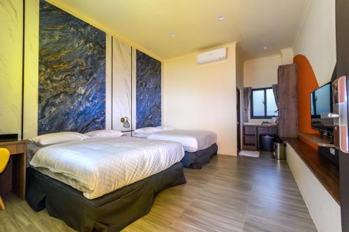 Ένα ή περισσότερα κρεβάτια σε δωμάτιο στο Bisck Hotel & Resort