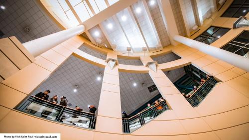 an overhead view of a building with people on a balcony at InterContinental St. Paul Riverfront by IHG in Saint Paul