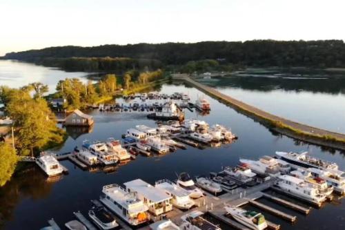 an aerial view of a marina with boats docked at Unique and Serene Sunset Houseboat for 4 in Savanna