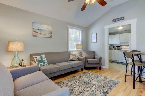 a living room with a couch and a table at Rare- Downtown 2 bedroom! Family friendly! in Dunedin